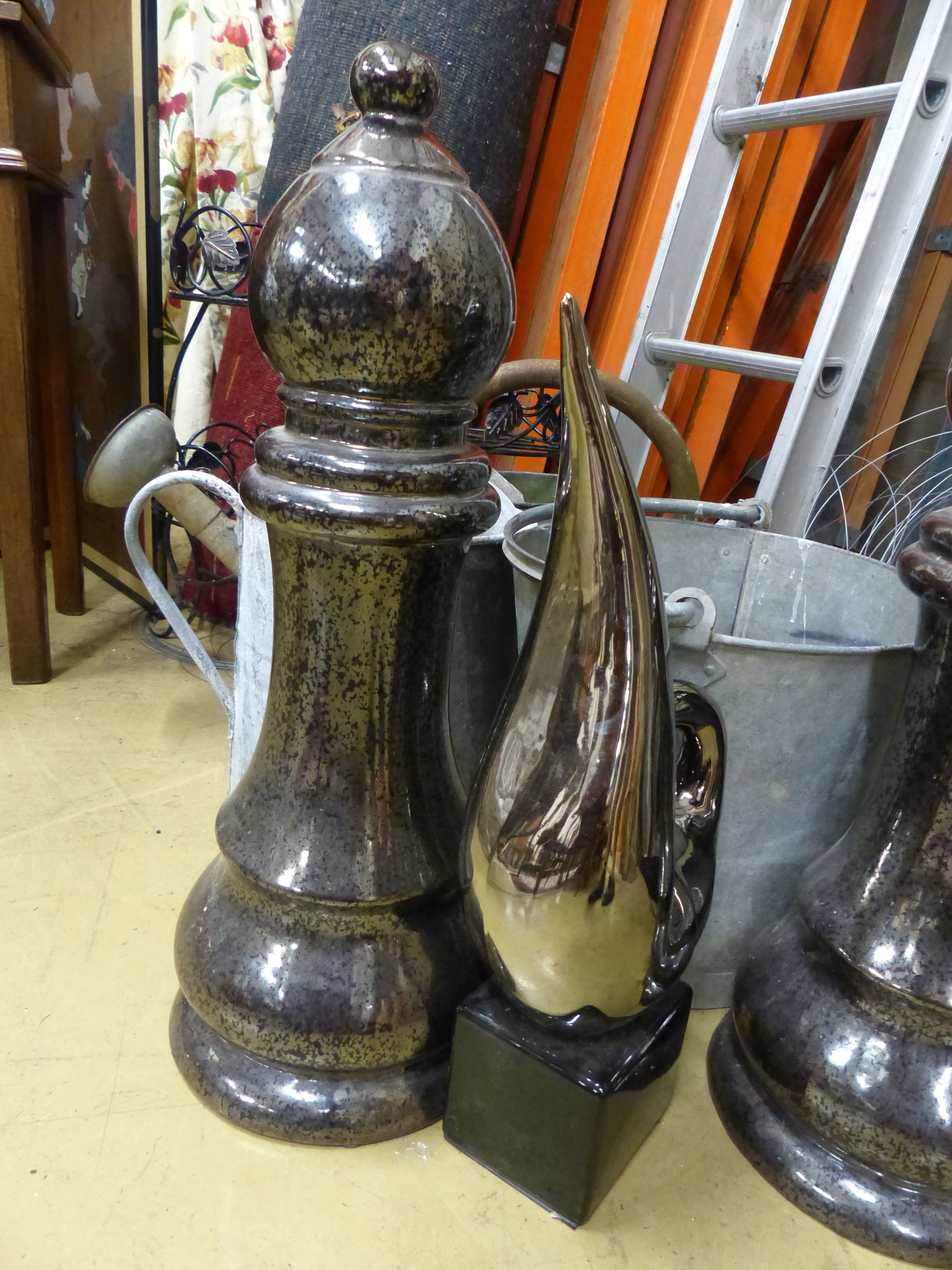 Assorted galvanized watering cans and assorted other metalware.